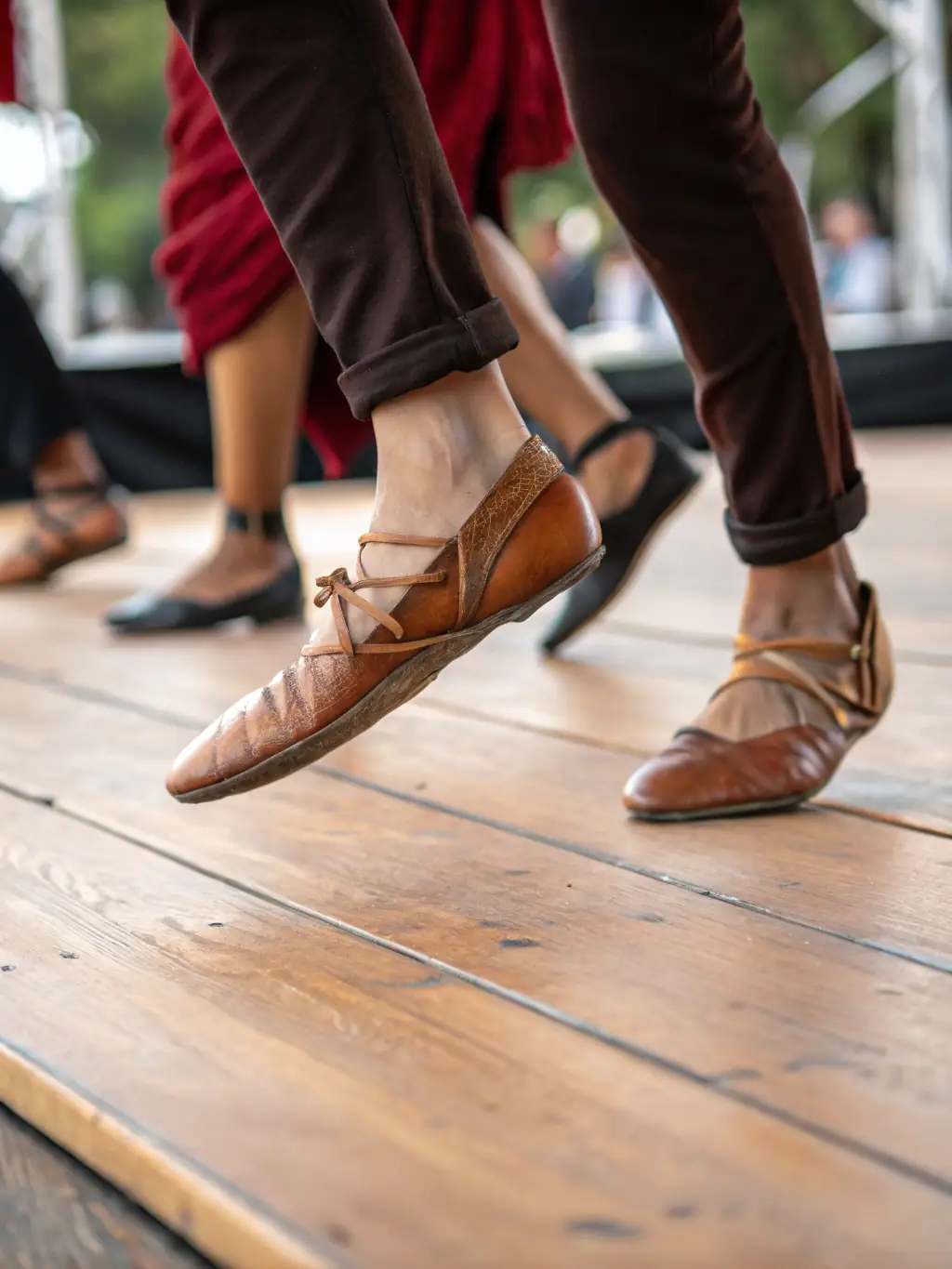 A close-up shot of dancers' feet moving quickly and precisely during a Modern Rock 4 Temps routine, emphasizing the footwork involved.